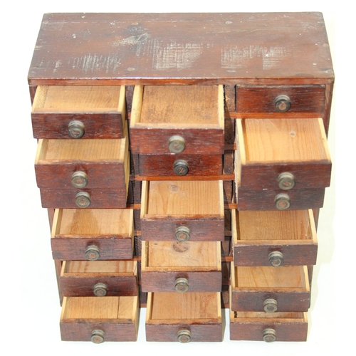 A small vintage multi-drawer engineers or collectors cabinet comprising ...