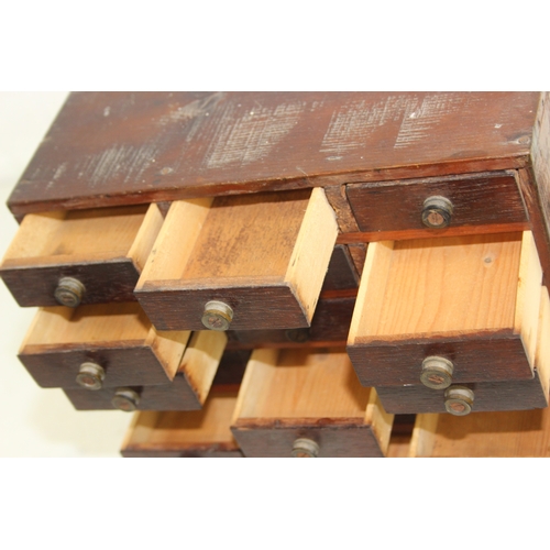 A small vintage multi-drawer engineers or collectors cabinet comprising ...