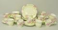 A Collingwood, 1930's, porcelain part tea service painted with flowers and with floral moulded handl... 