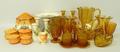 A quantity of 1930's pressed amber glass including two cake stands, two large bowls, 22cm diameter, ... 