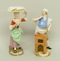 A pair of Meissen Cries de Paris figures, early 19th century, modelled as a scallop seller with a tr... 