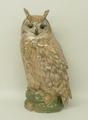 A Royal Copenhagen porcelain figure of a long eared owl modelled on a pine cone base, number 1331, 1... 