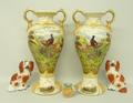 A pair of Staffordshire pottery flatback figures of spaniels, 14cm high, a Henriot Quimper faience s... 
