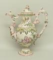 A French faience pottery coffee pot and cover, manner of Veuvre Perrin, of baluster form with scroll... 