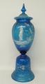 A Bohemian turquoise glass vase and cover, late 19th century, the vase of ovoid form on a bell shape... 