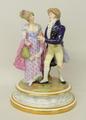 A Meissen style figure group depicting a 'Regence' couple, the gentleman proffering a posy to a lady... 
