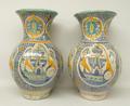 A pair of Mediterranean pottery vases, early 20th century, of baluster form decorated with a repeati... 