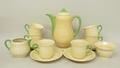A Clarice Cliff pottery part coffee service, circa 1930s, of baluster form with powder green spouts ... 