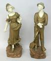A pair of Continental porcelain figures, late 19th century, modelled as farm labourers, the man with... 