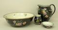 A Cetem ware pottery wash set, early 20th century, printed and painted with floral sprays against a ... 