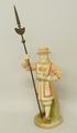 A Hadley's Royal Worcester blush ivory porcelain figure modelled as a Victorian Beefeater with metal... 