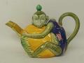A Mintons majolica monkey teapot, dated 1875, modelled as a nut enveloped by a monkey, its tail form... 