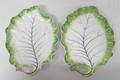 A pair of Chelsea, late 18th century, sweetmeat leaf dishes painted with green edging and lilac vein... 