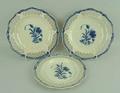 A pair of creamware lattice plates, possibly Leeds, late 18th century, painted in blue with a floral... 