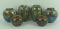 A pair of Royal Doulton stoneware vases of ovoid form moulded with flower heads, 17.5cm high, pair o... 