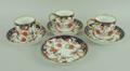 A set of three Royal Crown Derby porcelain coffee cans and four saucers, circa 1937, imari decorated... 