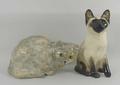 A Winstanley pottery tabby cat modelled crouching, with green glass eyes, signed, 17cm high, and a S... 