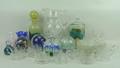 A quantity of glass, comprising; two boxed paperweights, two further paperweights, glass jug, eleven... 