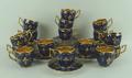 A set of French porcelain coffee cups and saucers, early 20th century, decorated with the crests of ... 
