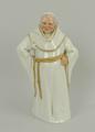 A Royal Worcester porcelain figure of a monk, circa 1882, modelled standing in white robes with gilt... 