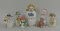 A group of Royal Copenhagen porcelain figures, boxed, comprising 'snowman with wristlet', 'snowman w... 