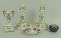 A pair of Meissen porcelain candlesticks, early 20th century, of hexagonal form raised on an outswep... 