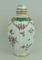 A Samson porcelain tea caddy and cover, late 19th century, of vertical fluted form, famille rose dec... 