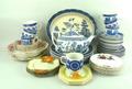 A quantity of Johnson Bros, Wedgwood and Wood & Sons blue and white pottery decorated in the 'Willow... 