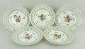 A set of Dresden style porcelain ribbon plates, late 19th century, painted with floral sprays, 19cm ... 