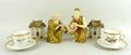A pair of Royal Worcester blush porcelain figures, circa 1910, of kneeling water carriers, no 637, a... 