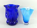 A trefoil shaped Bristol blue coloured glass vase with dimples decoration, 15cm high, and a blue han... 