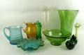 A blown green glass vase, three further vases, two jugs, two bowls, and two glass paperweights. (10)