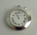 A Cartier pendulette voyage travel alarm clock with stainless steel body, etched design to face, scr... 