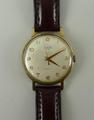 An Audax 17 jewel Incabloc 9ct gold gentleman's wristwatch with brown leather strap.