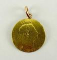 A George III half sovereign, with a pendant loop attachment, 4.2g total weight.