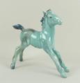 A Beswick blue glazed 'Large stretched foal', model number 836, first version, 13 by 13cm.  Note: th... 
