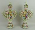 A pair of Continental porcelain vases and covers, late 19th century, of twin handled baluster rococo... 