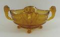 A Brockwitz amber glass bowl, circa 1930s, with twin lion handles, frosted panels moulded with acorn... 