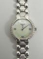 A lady's Tissot white gold and diamond dress watch with mother of pearl face, Roman quarter numerals... 