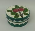 A Wemyss pottery rouge pot and cover of circular form painted to the lid with cherries, impressed an... 
