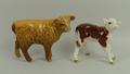 A Beswick figure modelled as a Highland Calf, no 18927D, 7cm high, and another of a Hereford Calf, n... 