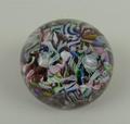 A scrambled glass millefiori paperweight, possibly Baccarat, bearing a cane with date for 1847, 6cm ... 