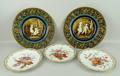 A pair of Austrian plates, circa 1900, the centre moulded with figures, the exterior band in blue gr... 
