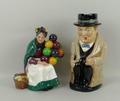 A Royal Doulton figure modelled as 'The Old Balloon Seller', HN1315, and a Worcester Winston Churchi... 