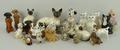 A quantity of Beswick and Royal Doulton ornaments, in the form of various cats and dogs. (23)