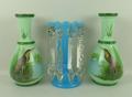 A Victorian turquoise glass lustre with prismatic clear glass drops, 24.5cm high, and a pair of gree... 
