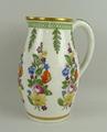 A porcelain water jug, early 19th century, moulded and painted with flowers and leaves, number 6, 20... 