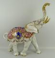 A Rudolph Kammer, Volkstedt, porcelain figure of an elephant, 20th century, modelled standing with i... 