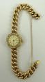 A lady's gold wristwatch, circular dial, bearing Roman numerals, Arabic seconds, old cut diamond set... 
