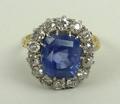 An 18ct gold, Seylon sapphire and diamond ring, the central square cut sapphire, approximately 7.5ct... 